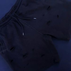 Distressed sweatpant shorts